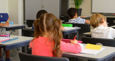 Multicultural Elementary Students Writing in Classroom - Download Free Stock Images Pikwizard.com