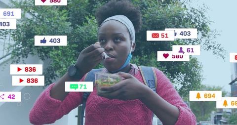 Young Woman Eating Salad Surrounded by Social Media Icons