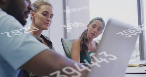 Team Analyzing Data on Laptop for Business Strategy Collaboration