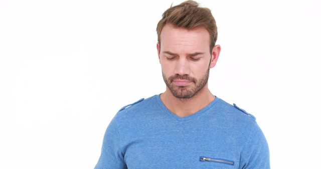 Pensive Young Man with Downcast Eyes in Casual Blue Shirt - Download Free Stock Images Pikwizard.com