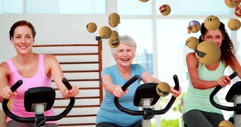 Group of women energized cycling with playful emojis