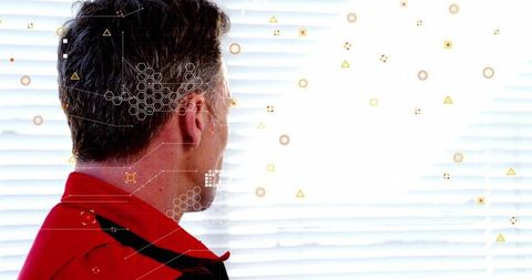 Man in Red Jacket Facing Window Blinds with Futuristic Digital Overlay and Copy Space
