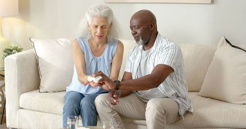 Senior Couple Sharing Tender Moment on Living Room Sofa