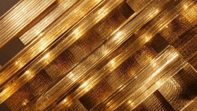 Abstract Close-up of Translucent Golden Bars Illuminated by Embedded LED Lights