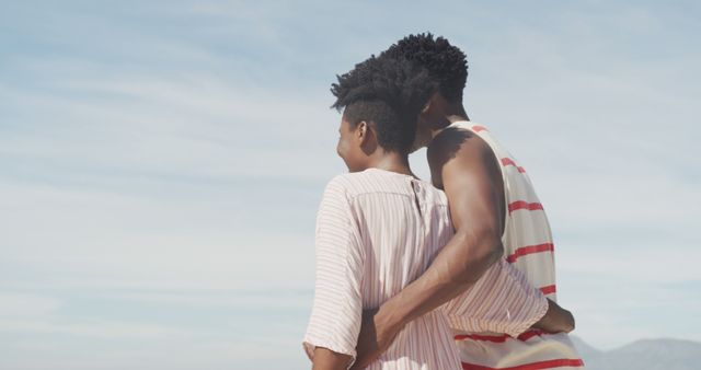 Happy Couple Embracing at Beach with Clear Sky in Background - Download Free Stock Images Pikwizard.com