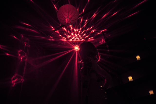 Woman Dancing at Nightclub Under Neon Red Lights - Download Free Stock Photos Pikwizard.com