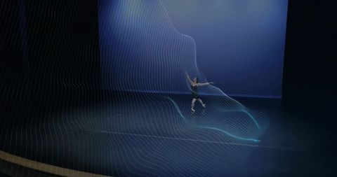 Contemporary Dancer on Stage Enveloped in Digital Wave Projection