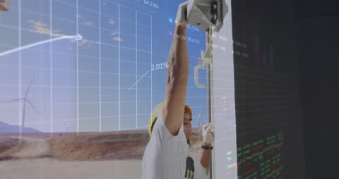 Engineer Analyzing Financial Data with Wind Turbines Overlay