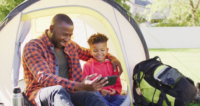 Father and Son Enjoying Time Outside Using Smartphone - Download Free Stock Images Pikwizard.com