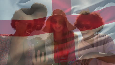 Friends Enjoying a Beach Vacation with England Flag Overlay