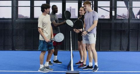 Diverse Group Enjoying Padel and Building Camaraderie