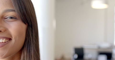Confident Young Professional Woman in Bright Office Environment