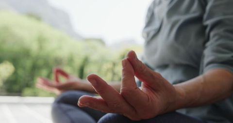 Senior Woman Meditating Outdoors Promoting Inner Peace and Relaxation