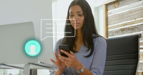 Businesswoman engaging with digital communication tools in workspace