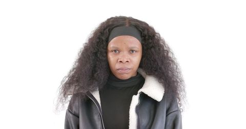 Confident businesswoman in black jacket displaying determination