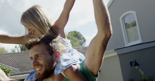 Father Giving Daughter a Piggyback Ride on a Sunny Day - Download Free Stock Images Pikwizard.com