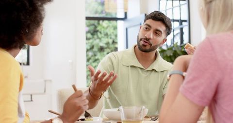 Diverse friends enjoying brunch in home setting