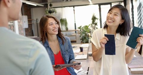 Creative team reviewing fabric swatches in modern office atmosphere