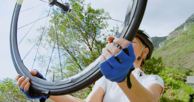 Cyclist Changing Bicycle Tire Outdoors in Nature - Download Free Stock Images Pikwizard.com