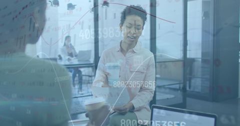 Collaborative business meeting with financial data