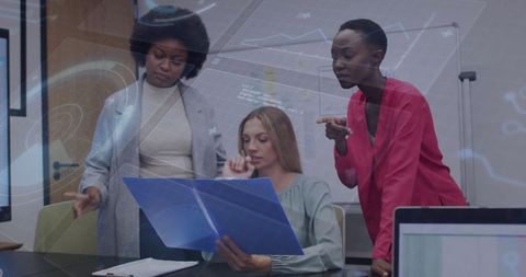 Diverse Team Analyzing Data on Digital Interface at Conference Table
