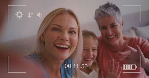 Three Generation Family Making Video Messages at Home