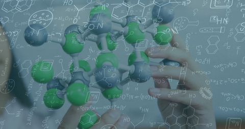 Hands Holding Molecular Model Overlayed with Scientific Formulas