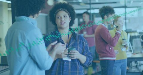 Diverse team collaborating in modern office setting with dynamic data overlay