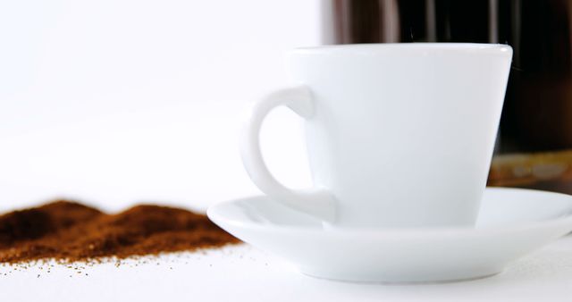 White Cup with Coffee Grounds and Blurred Coffee Background - Download Free Stock Images Pikwizard.com
