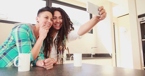 Happy Friends Taking Selfie in Modern Kitchen