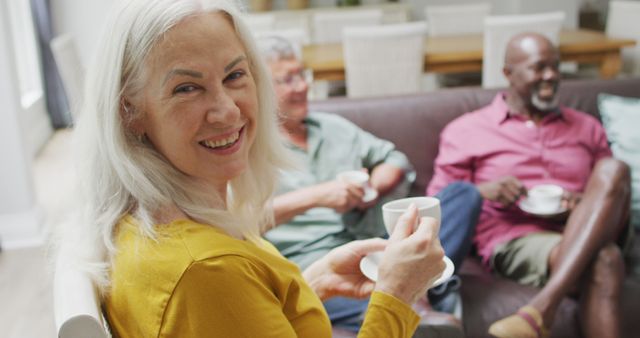 Seniors Relaxing at Home Enjoying Coffee Together - Download Free Stock Images Pikwizard.com