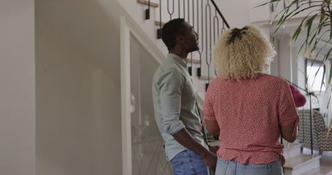 Friends Socializing Happily in Modern Living Room