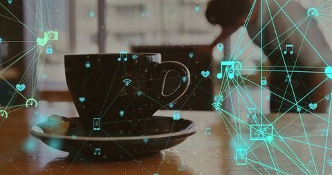 Coffee Cup with Overlay of Digital Network Icons