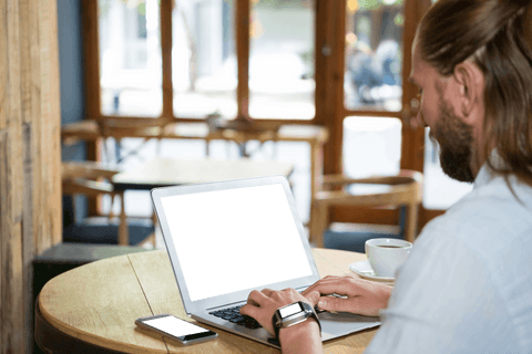 transparent tech use: man on laptop in coffee shop - Download Free Stock Videos Pikwizard.com