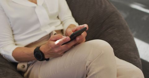 Businesswoman Relaxing and Using Smartphone in Office - Download Free Stock Images Pikwizard.com