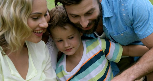 Happy Family Bonding Outdoors with Son - Download Free Stock Images Pikwizard.com