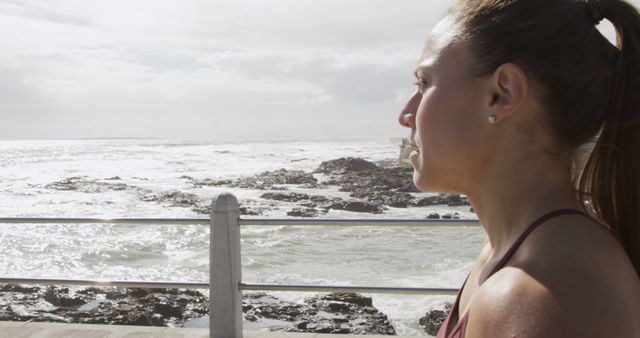 Sporty Woman Looking at Ocean Horizon During Fitness Run - Download Free Stock Images Pikwizard.com