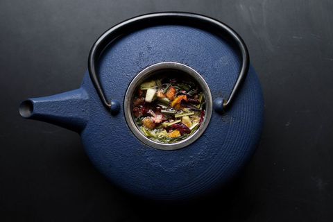 Top view of ceramic teapot with herbal infusion