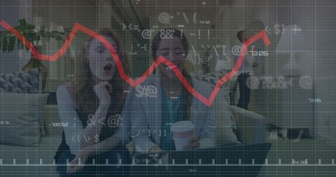 Businesswomen analyzing financial data with modern graphs
