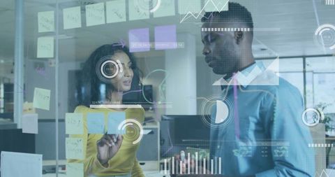 Two Coworkers Collaborating and Brainstorming in Modern Office Setup