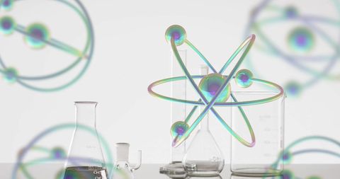 Atoms and Laboratory Glassware Imagery in Scientific Setting