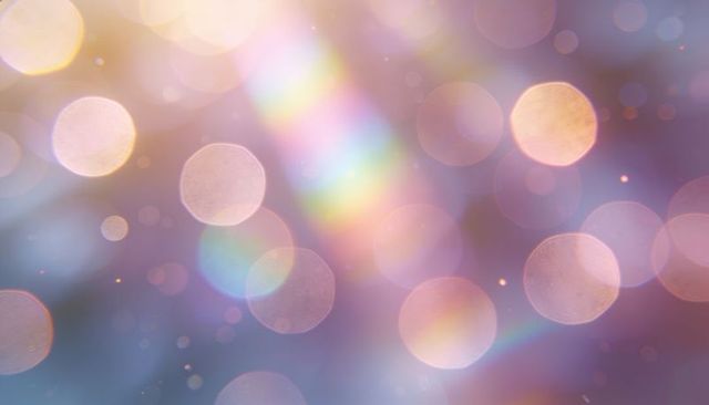Dreamy pastel bokeh with prismatic light streaks, glowing orbs and soft sparkle gradient