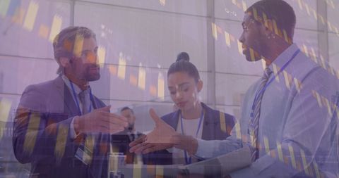 Diverse business team discussing with financial data overlay