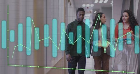 Colleagues Analyzing Graphs in Office Hallway - Download Free Stock Images Pikwizard.com