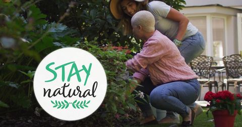 Loving Couple Enjoying Gardening Together in Lush Garden