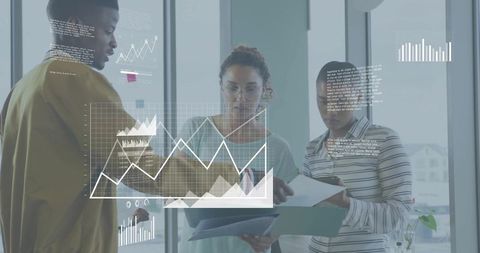 Collaborative team reviewing data overlays and charts in modern glass office workspace