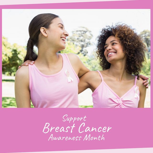 Two diverse women smiling and wearing pink shirts with pink ribbons. Ideal for campaigns, flyers, social media posts or articles promoting Breast Cancer Awareness Month and breast cancer advocacy.