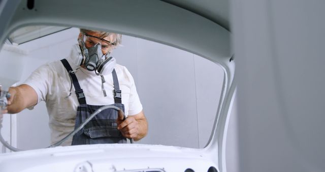 Automotive Technician Spray Painting Car Body in Workshop - Download Free Stock Images Pikwizard.com