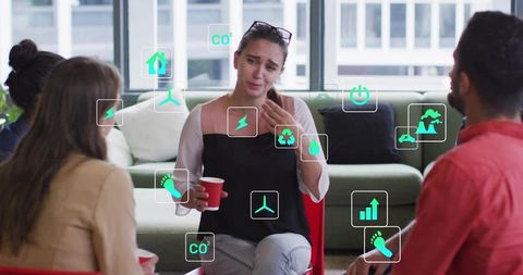Business Team Discussing Sustainability and Collaboration in Modern Office with AR Eco Icons