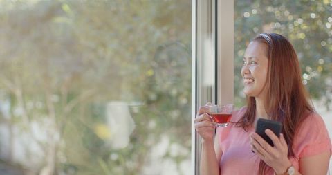 Mature Woman Enjoying Tea Indoors Home Relaxation Concept